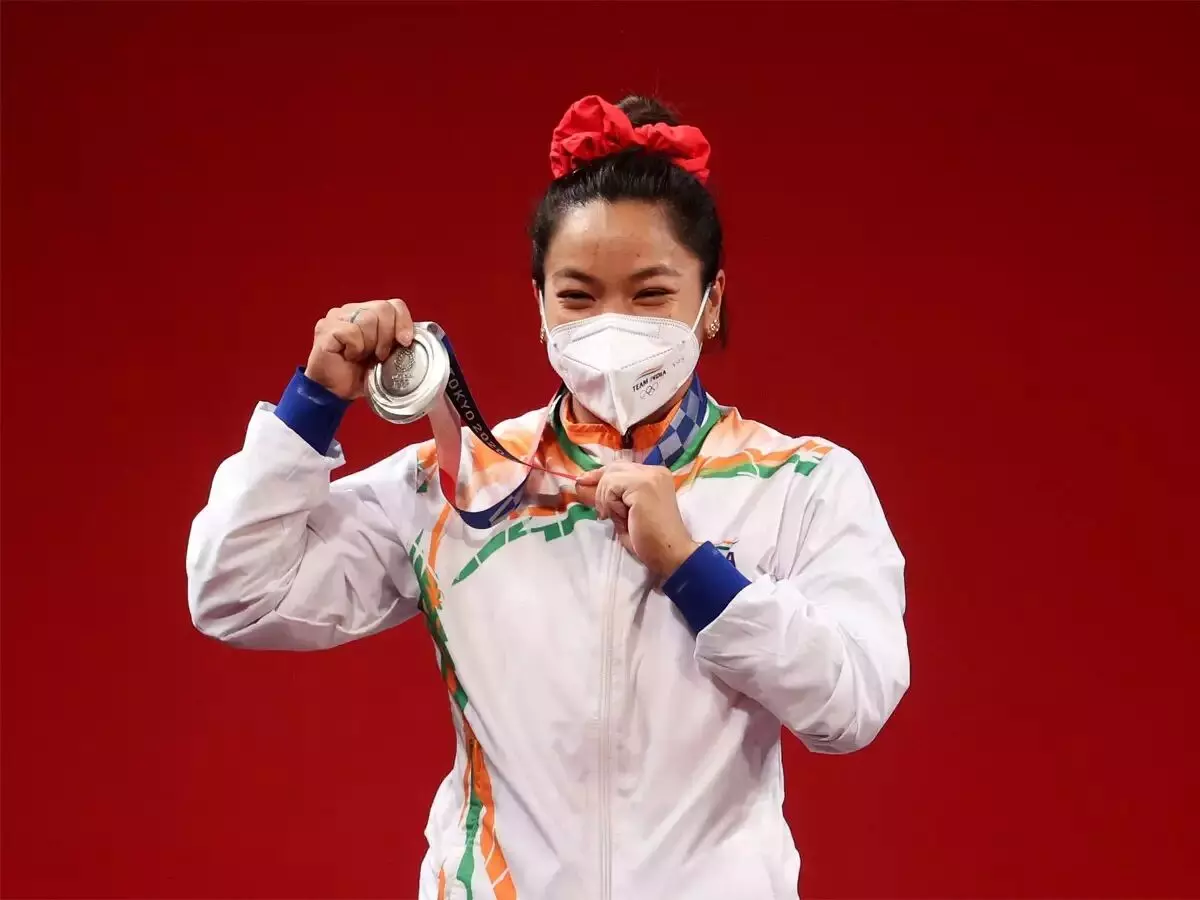 Indias first medal winner at Tokyo Olympics Mirabai Chanu gets heros welcome on return to country