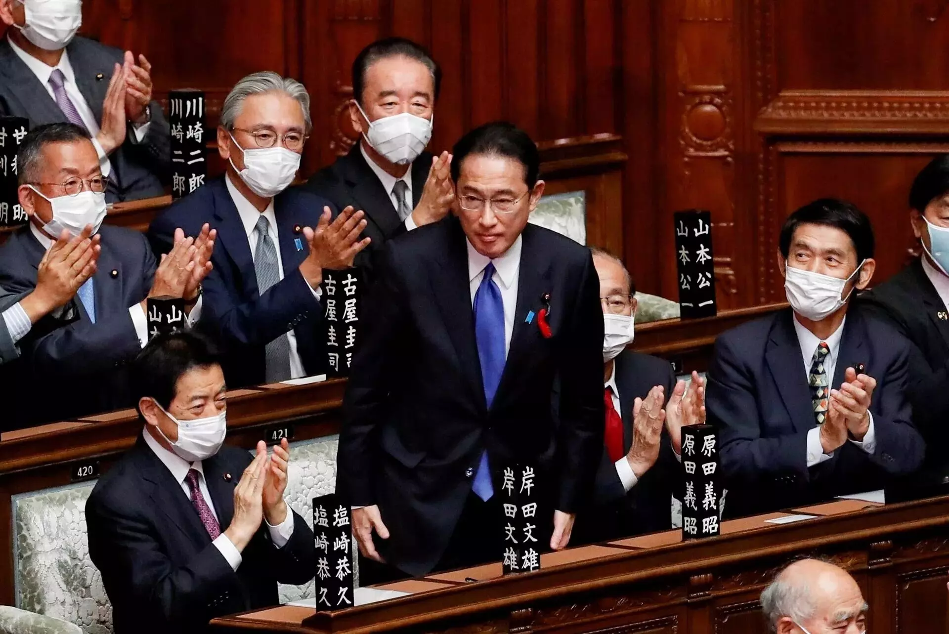 Japans Parliament elects former diplomat Kishida as new PM