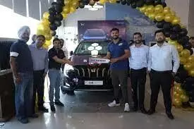 Sumit Antil, a paralympian, receives the Mahindra XUV700 Javelin Gold Edition