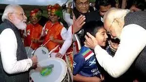 Prime Minister Narendra Modi plays the drums with Indians in Scotland