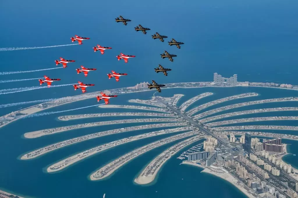Indian Airforce Suryakiran Aerobatics Team and UAEs Al Fursan Display Team fascinating flypast at Dubai Air Show 2021