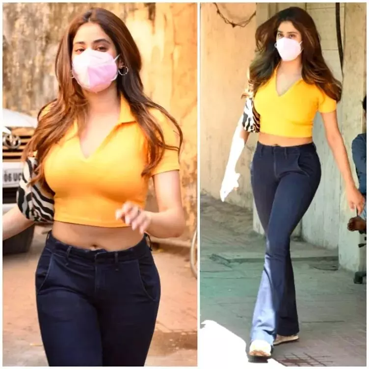 Jahanvi Kapoor keeps her OOTD simple yet bright in yellow with a crop top & bootcut jeans