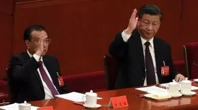 China reaffirms Xi Jinpings power, removes No. 2