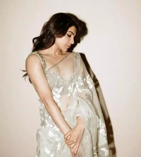 Samantha looks elegant as ever in ivory saree and embellished blouse.