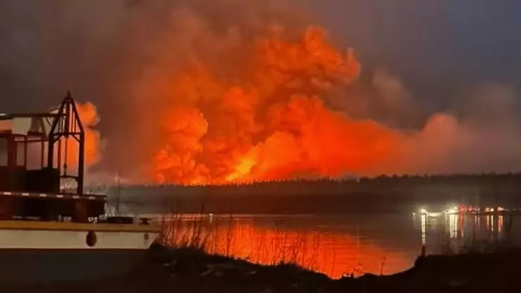 Wildfires spread across western Canada, forces thousands to evacuate