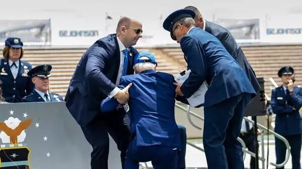 Biden trips and falls during US Air Force graduation ceremony