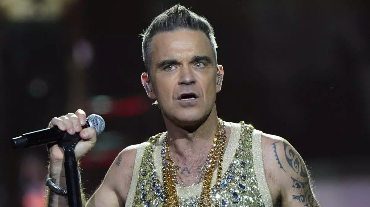 Robbie Williams fan dies after falling down six rows of seats