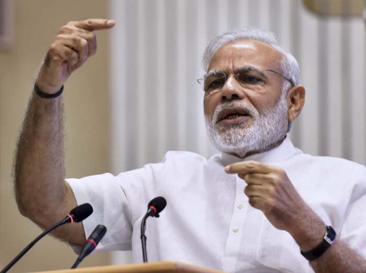 In emotional speech, Modi defends currency spike