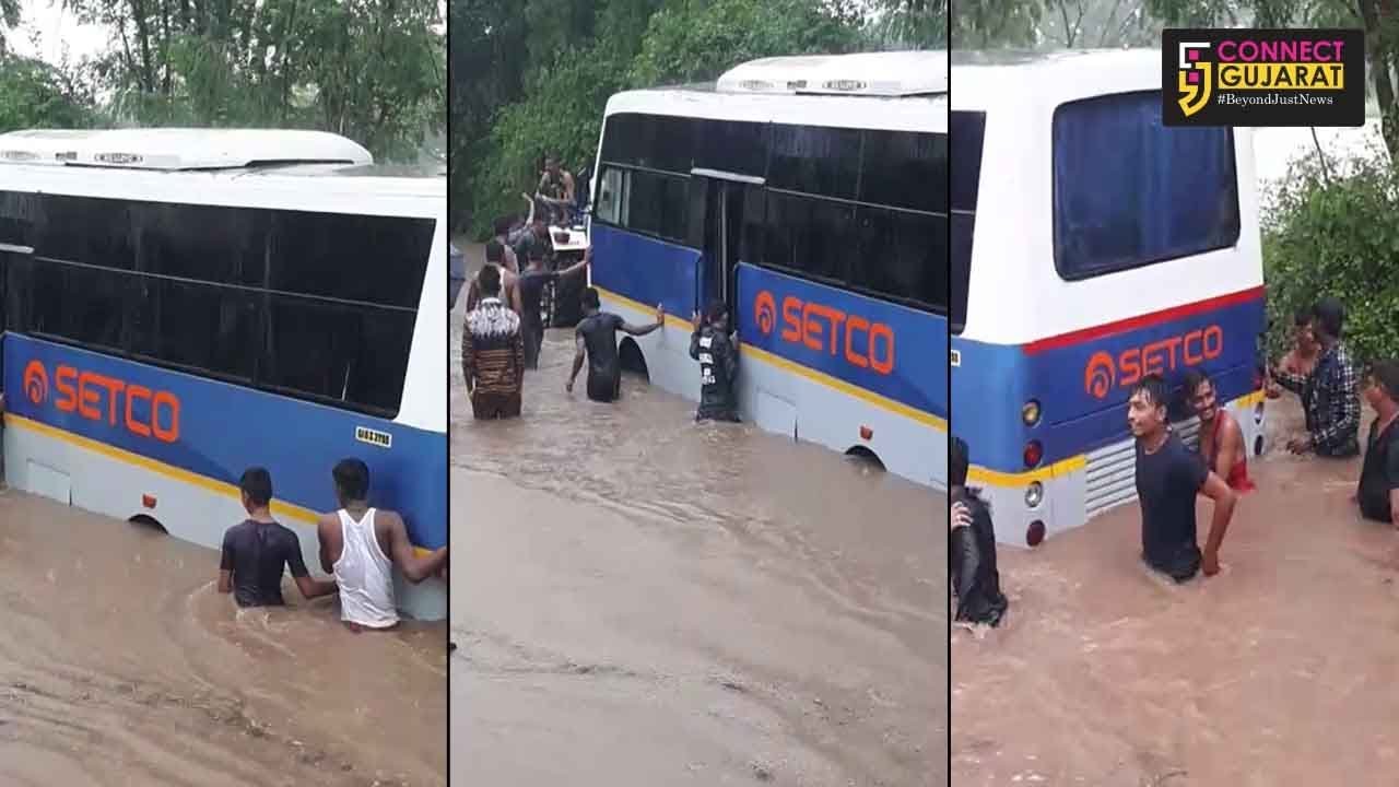Luxury bus with students stuck in water at Padra