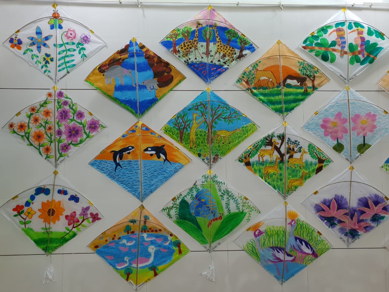 Students draw images related to nature on kites