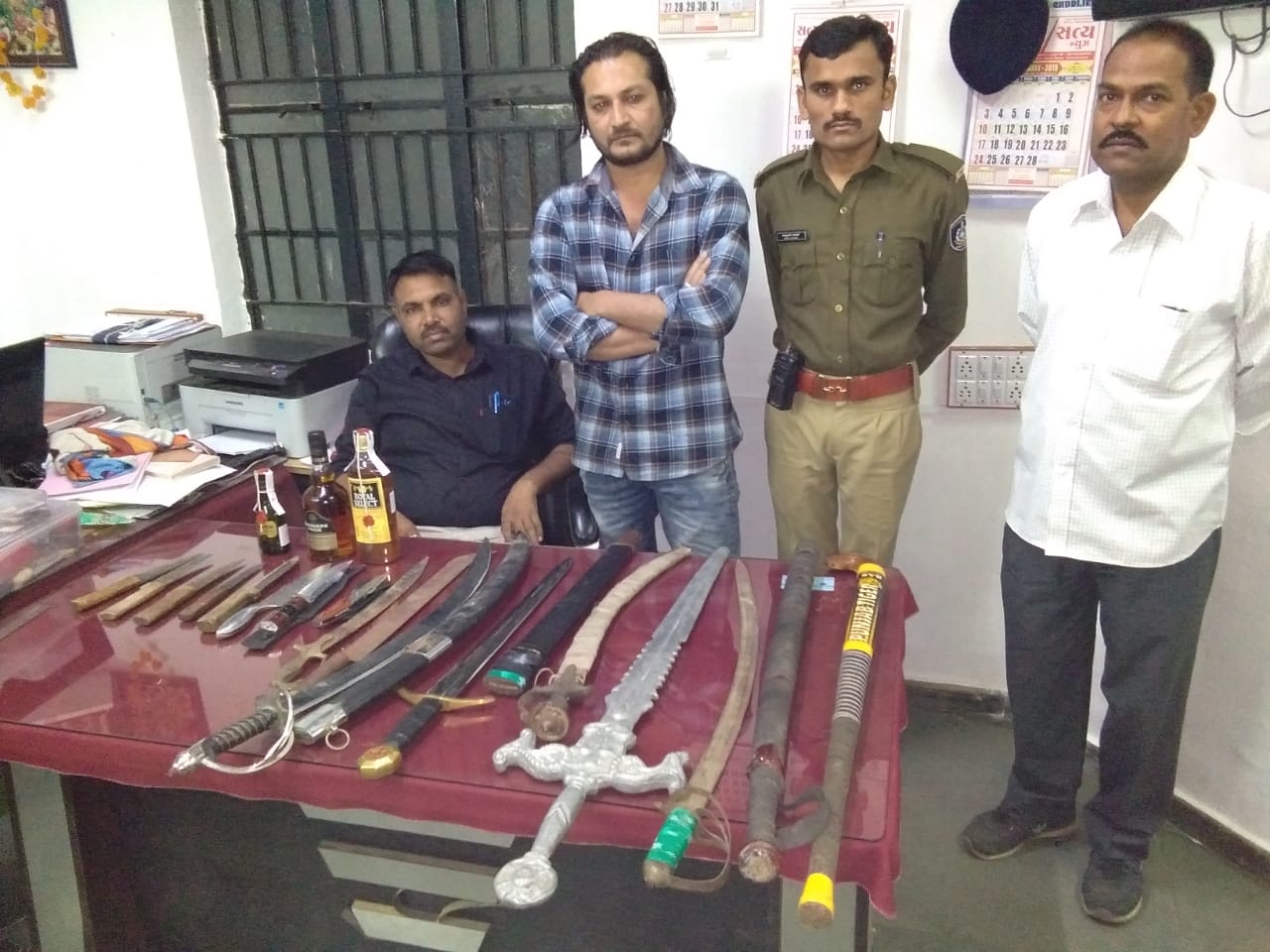 Karelibaug police surveillance squad caught two accused with weapons and liquor