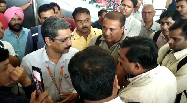 Heated arguments between passengers and airport officials at Vadodara airport due to delay in Air India flight