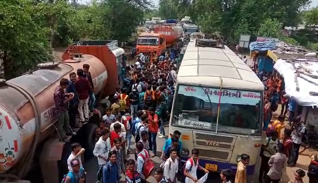 College and school students block road near Mahuvad in Padra due to shortage of bus