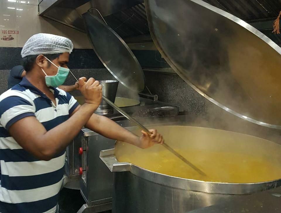  Khichdi Meal being prepared  by IRCTC  at Mumbai Central Base Kitchen. Also seen is various images of distribution of food packets being done across the Western Railway zone by RPF & NGOs.