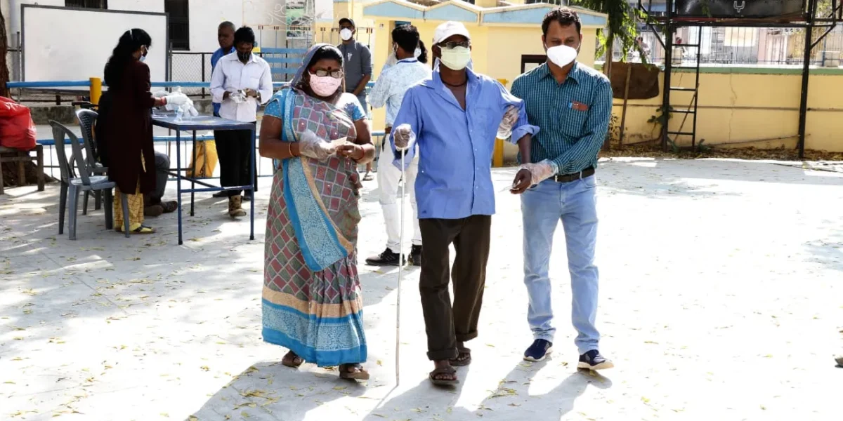 Blind voter Bharat Thakor cast his vote in Vadodara with family