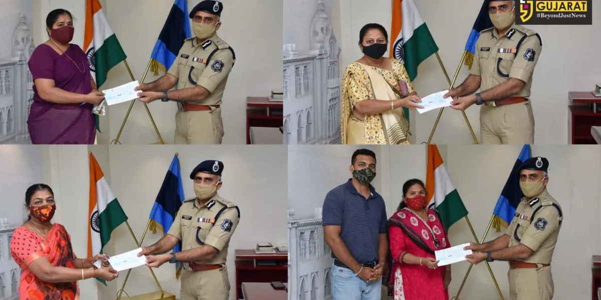 Vadodara police commissioner handover assistance cheques to family members of policemen died due to corona