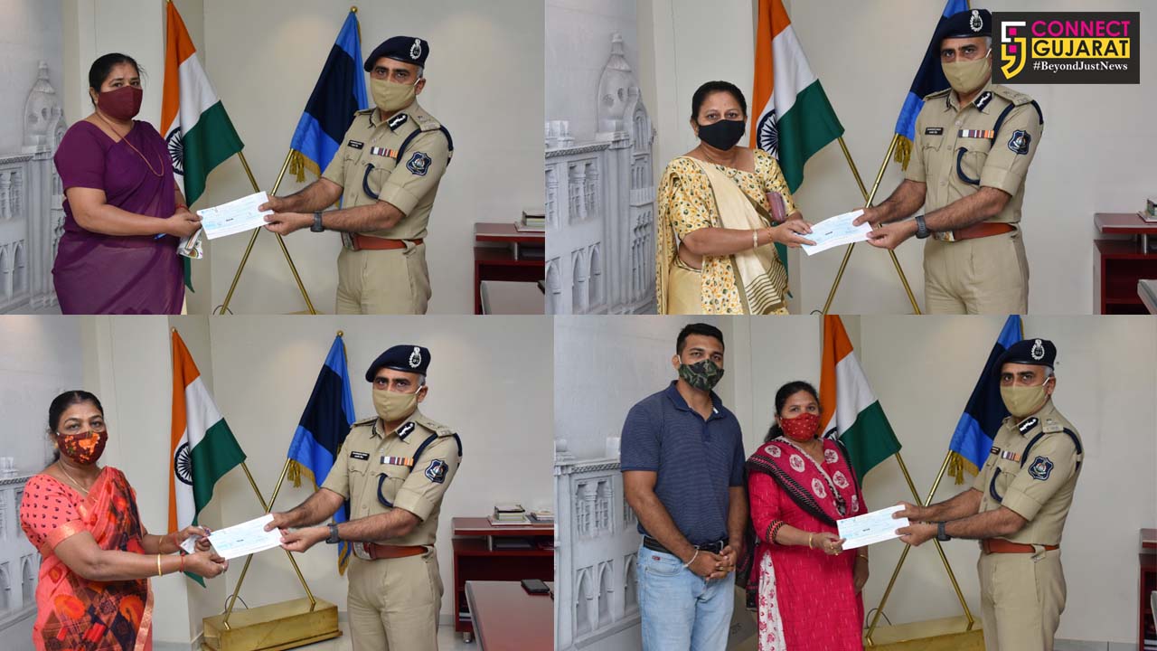 Vadodara police commissioner handover assistance cheques to family members of policemen died due to corona