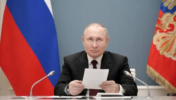 Russian PM Vladimir Putin signs law enabling him to serve two more terms