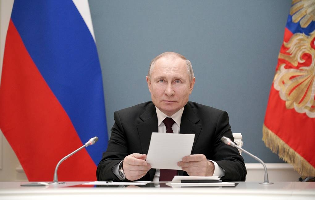 Russian PM Vladimir Putin signs law enabling him to serve two more terms