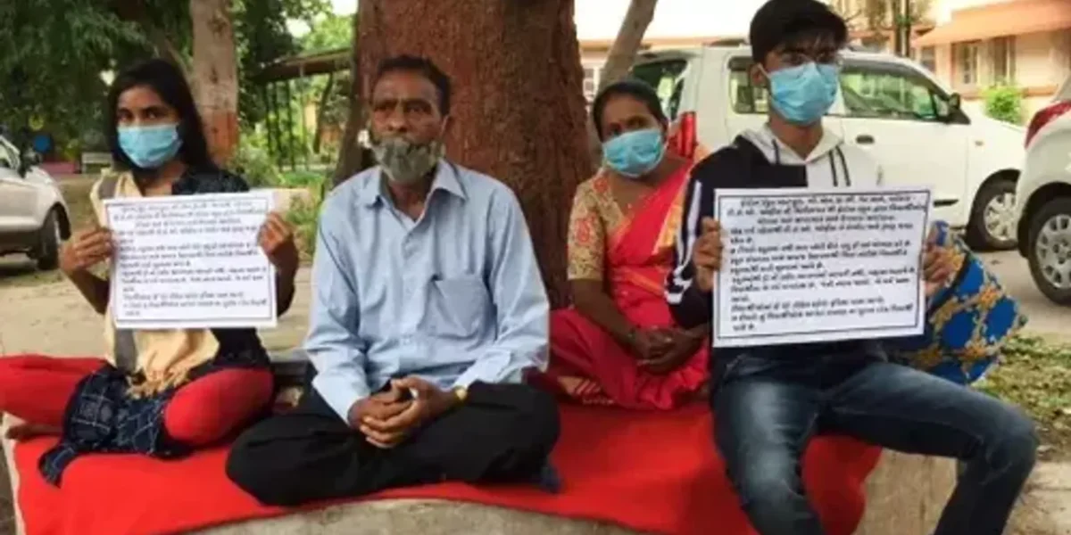 Student with family sit on fast outside Vadodara DEO office