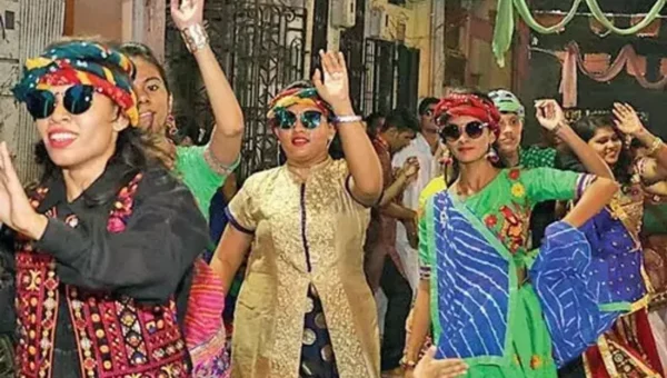 Garba enthusiasts in Vadodara play garba with umbrellas amid showers