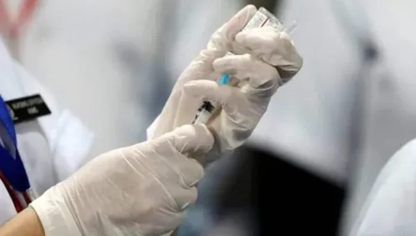 As Covid-19 cases multiply, frontline workers and seniors receive ‘precautionary doses’