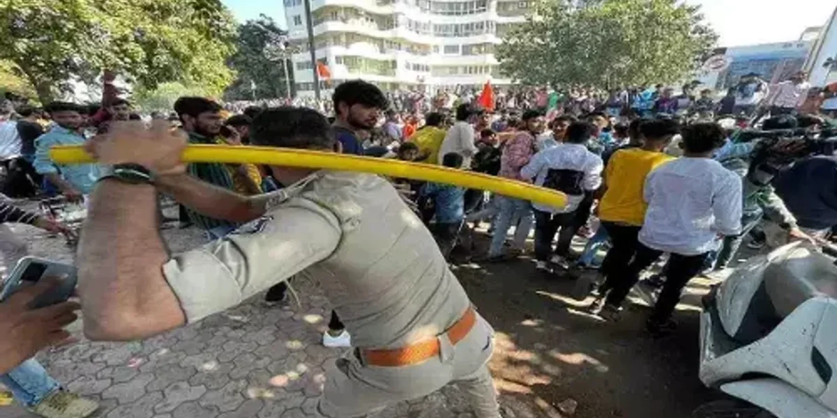 In Rajkot, Gujarat, a mob vandalises a police truck and shops