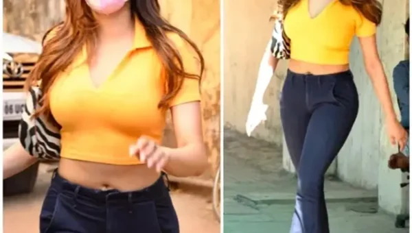 Jahanvi Kapoor keeps her OOTD simple yet bright in yellow with a crop top & bootcut jeans