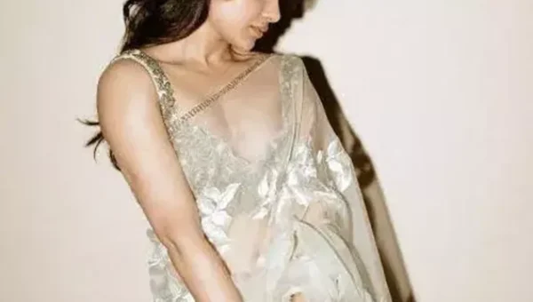 Samantha looks elegant as ever in ivory saree and embellished blouse.