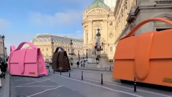 Giant Jacquemus handbags zip through the streets of Paris