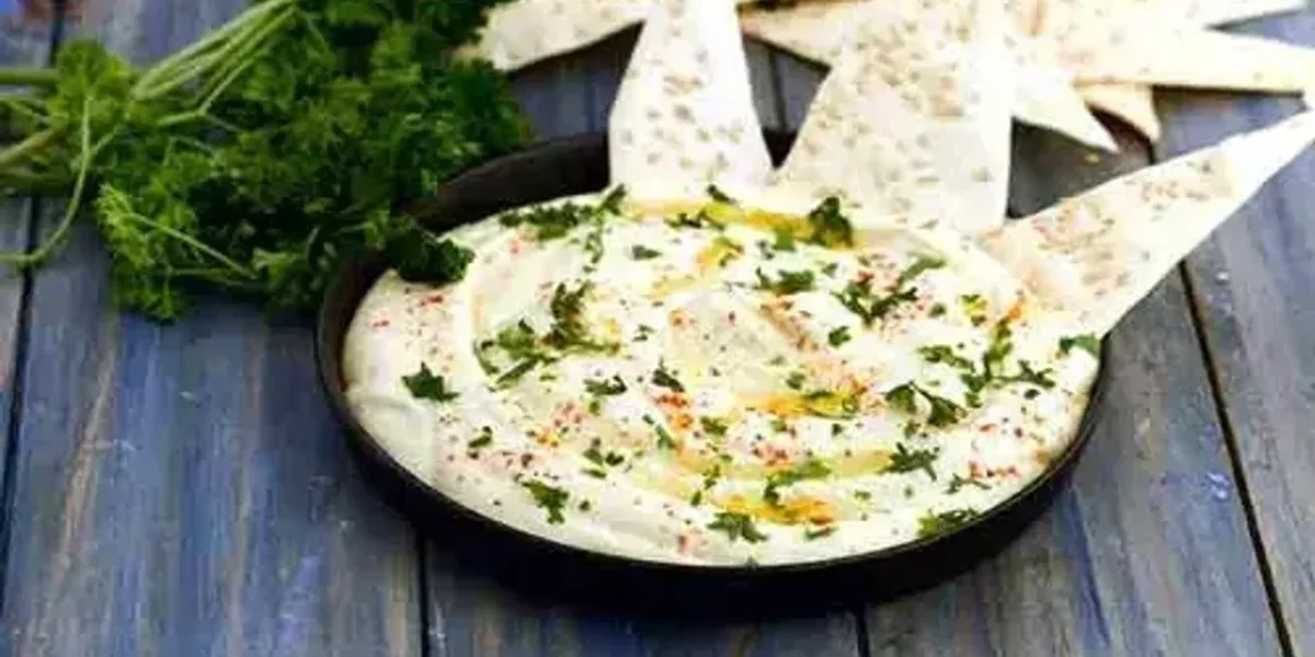 Veggie Supreme Spinach Nachos Recipe: Topped with a luscious, velvety cheese dip, these nachos are a true delight for both your taste buds