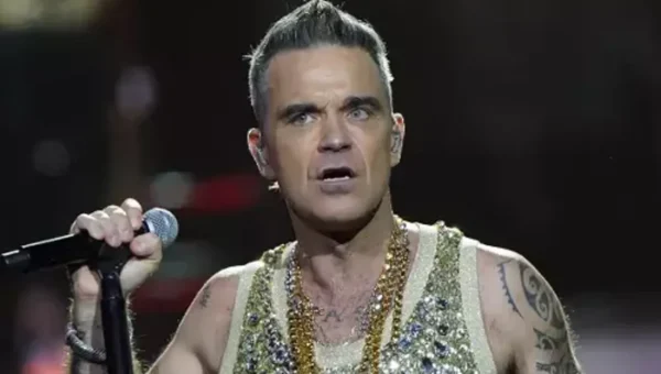 Robbie Williams fan dies after falling down six rows of seats
