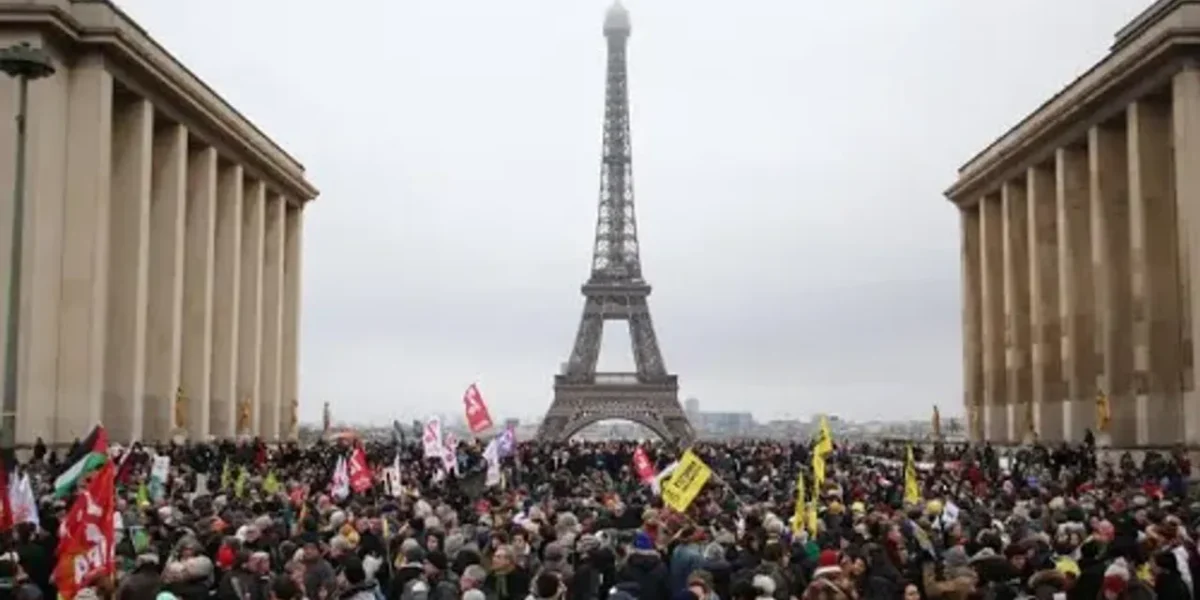 Thousands of protesters march against France’s immigration bill