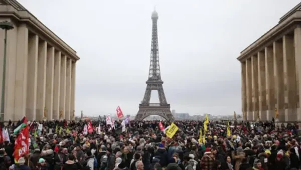 Thousands of protesters march against France’s immigration bill