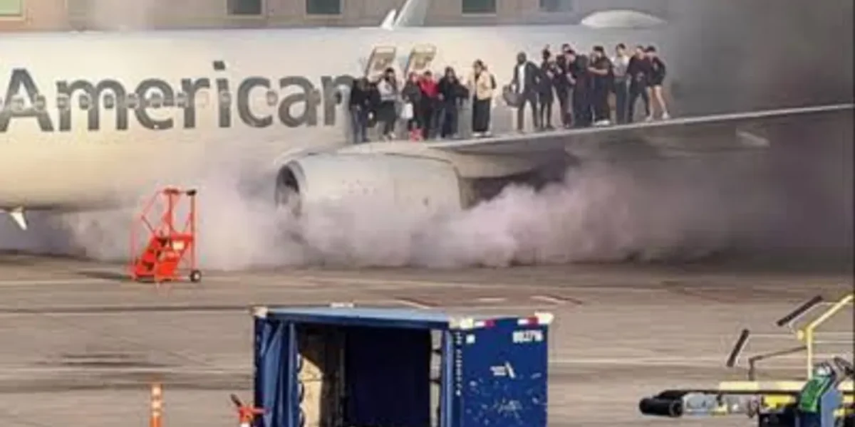 Passengers evacuate Onto Wing as American Airlines plane catches fire in Denver