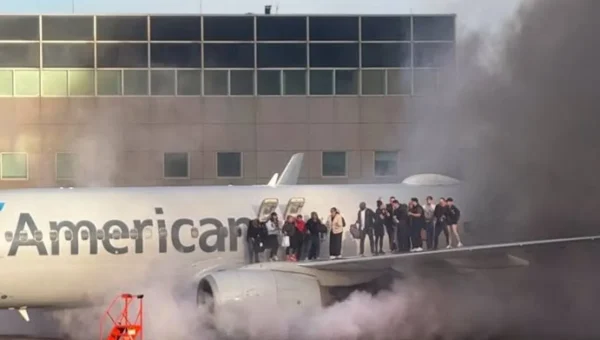 Passengers evacuated after American Airlines plane catches fire at Denver Airport